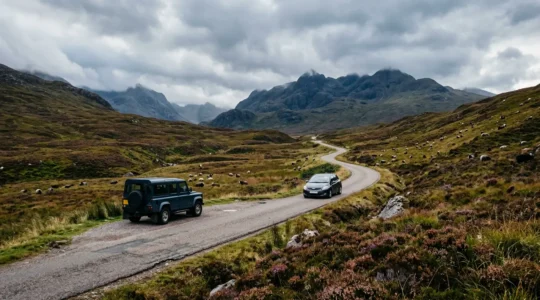 Car waiting at a passing place on a narrow single-track road in the Scottish Highlands