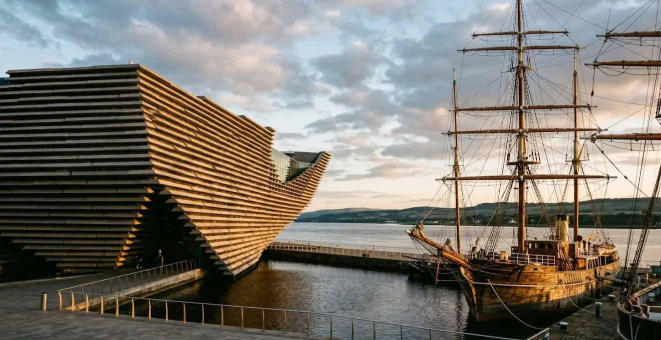 V&A Dundee modern architecture alongside historic RRS Discovery ship at waterfront